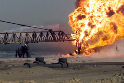 Firefighters fight an oil blaze